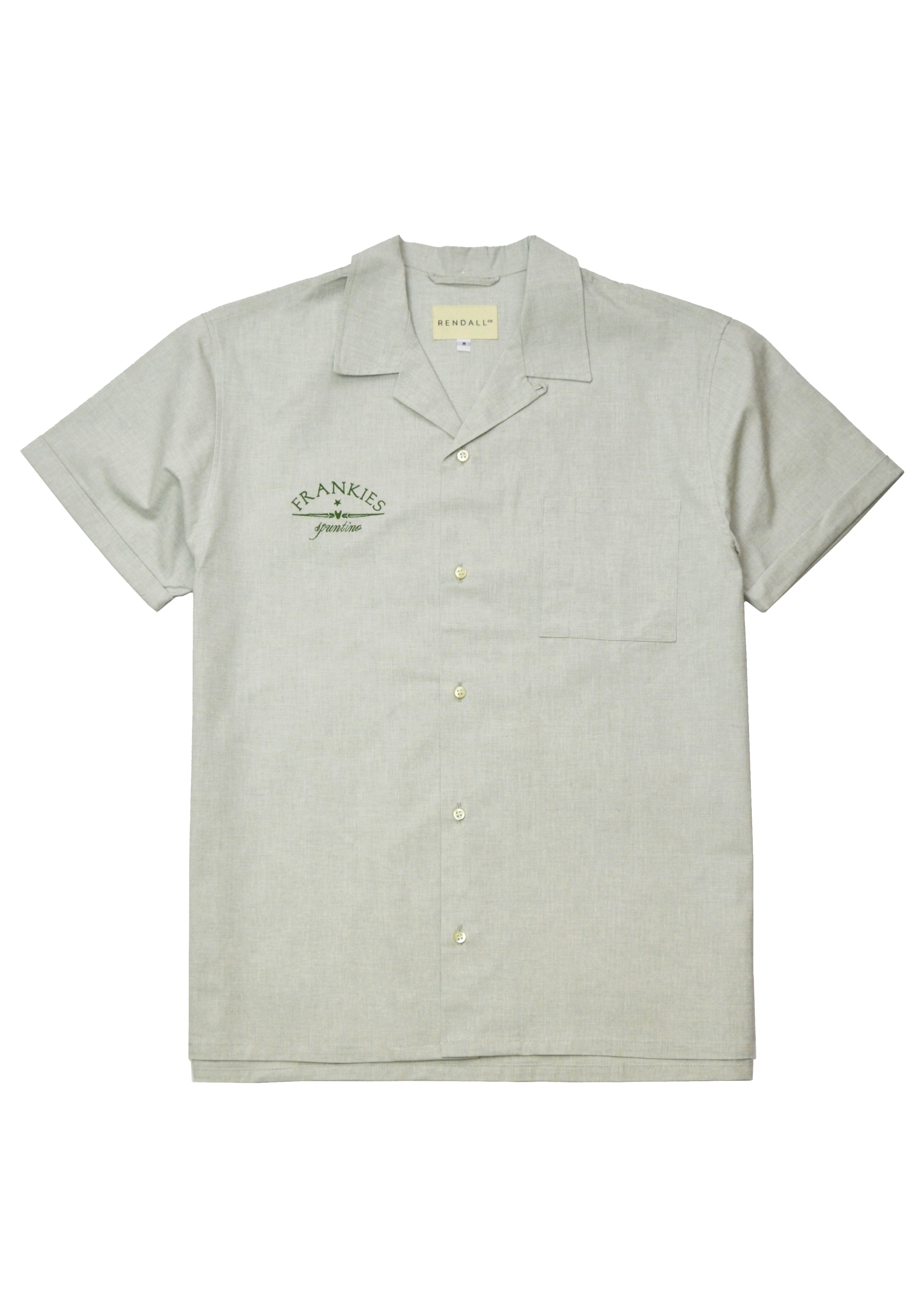 A short-sleeved olive green camp shirt with a collar, button-up front, and a brand tag on the left chest.
